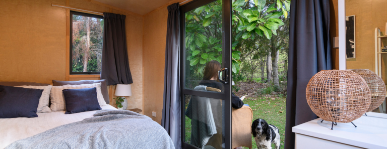 women reading outside rent cabin